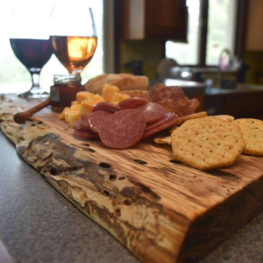 Ash live edge serving board with natural edge detail