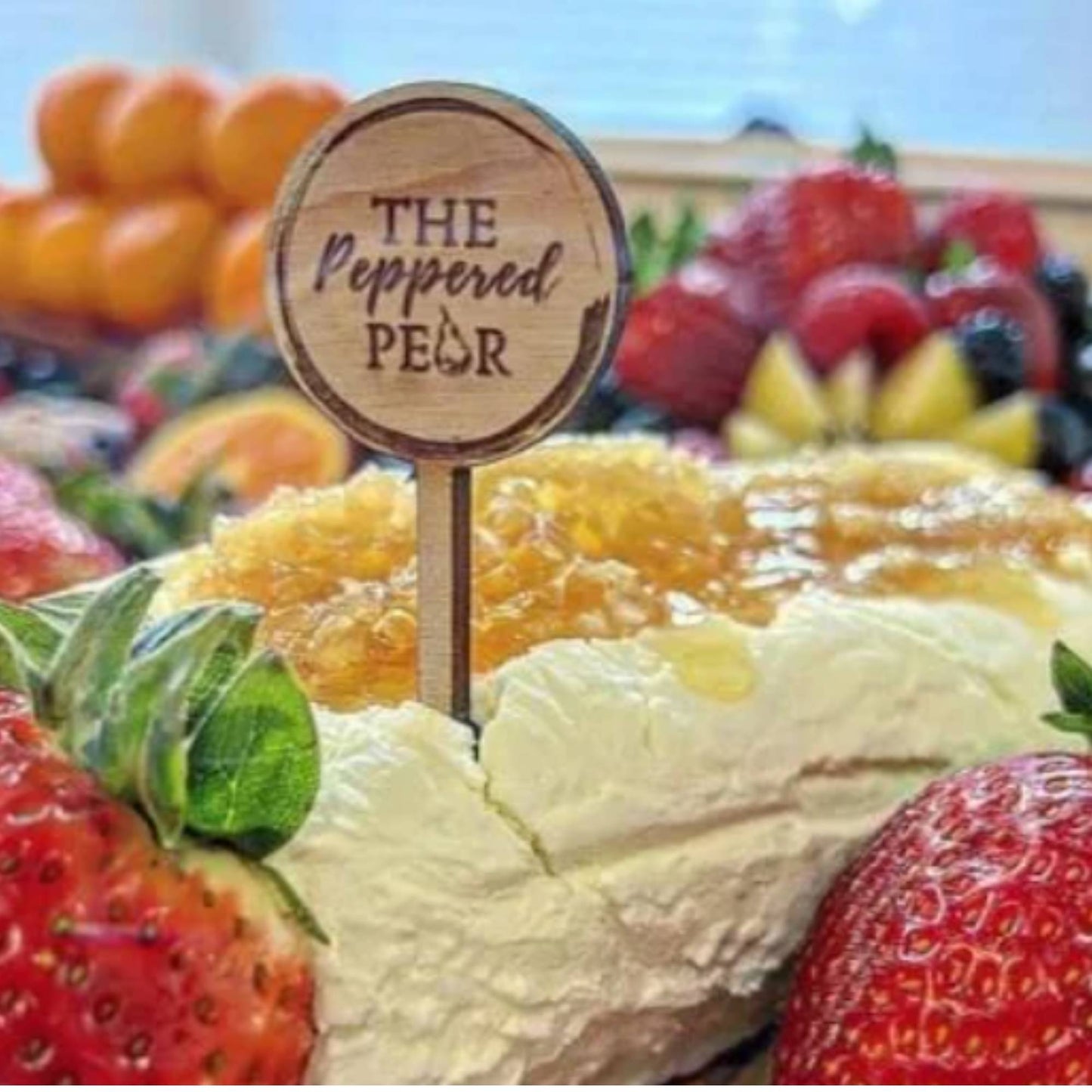 custom engraved wood charcuterie food pick on a charcuterie table