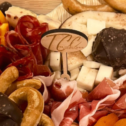 wood oval charcuterie food pick custom engraved on a charcuterie spread