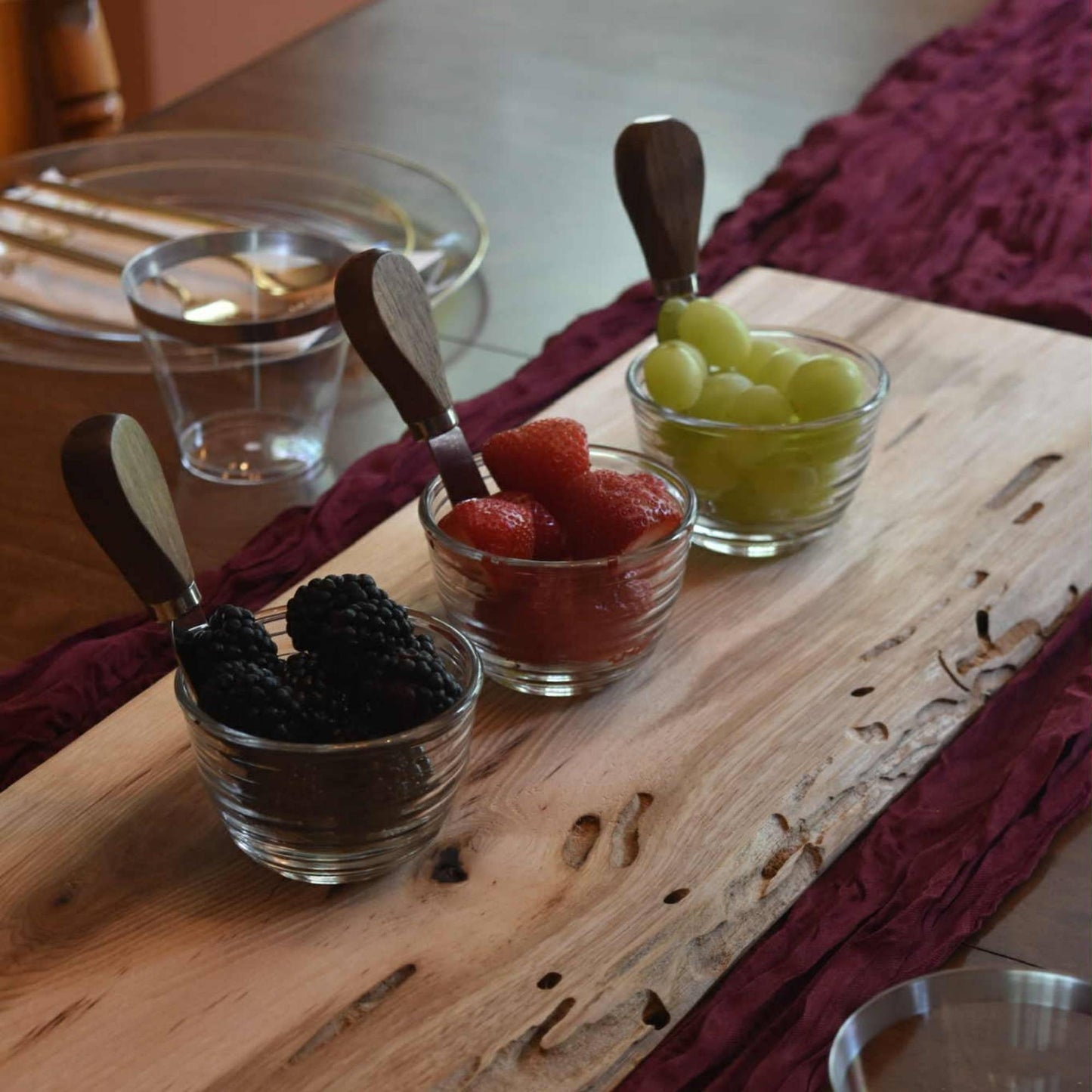 hickory live edge serving board used for serving fruits for charcuterie