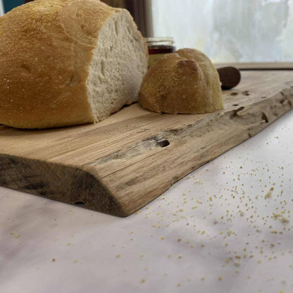 close up of Hickory live edge serving board with bread and honey