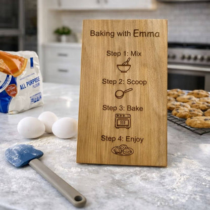 kid's recipe board sitting on a kitchen island with baking ingredients