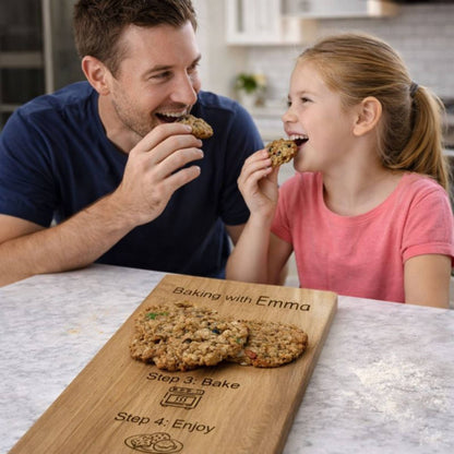 father and daughter eating the cookies from the recipe on the recipe board