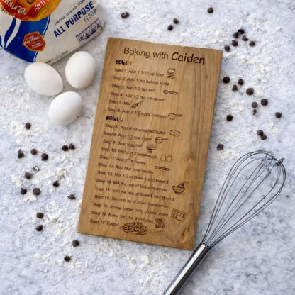a kid's teaching recipe board on a kitchen island with baking ingredients