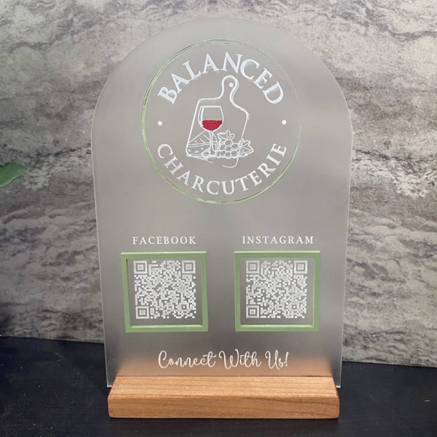 frosted acrylic business sign with logo and QR codes in a layered design 