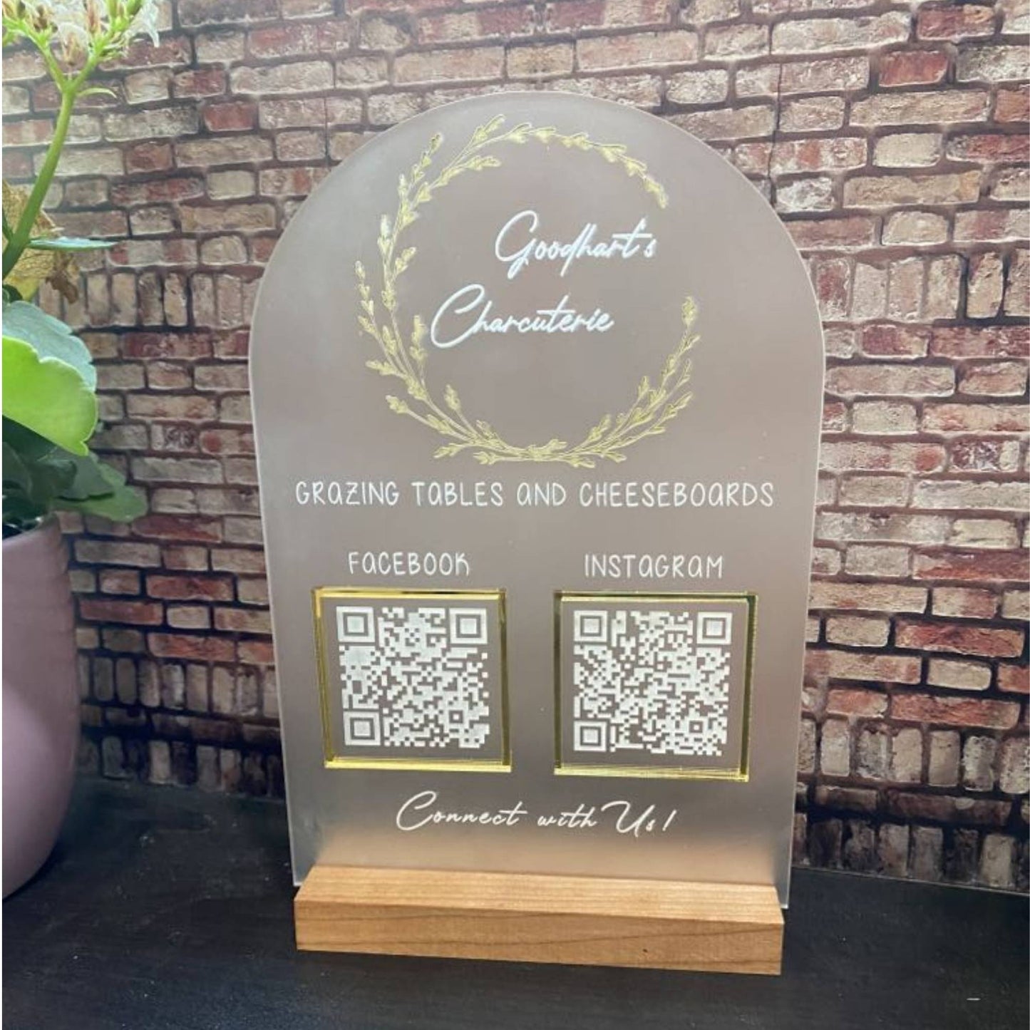 frosted acrylic business sign with logo and QR codes in a layered design and hardwood base