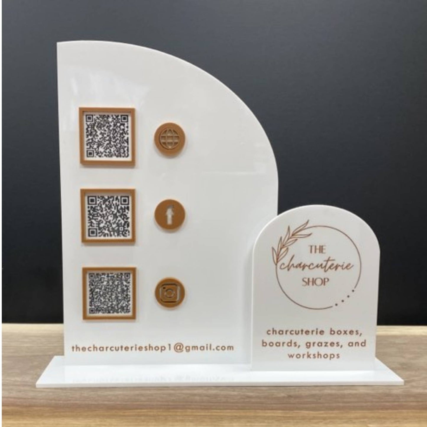 business sign with half arch and full arch layered with QR codes and logo