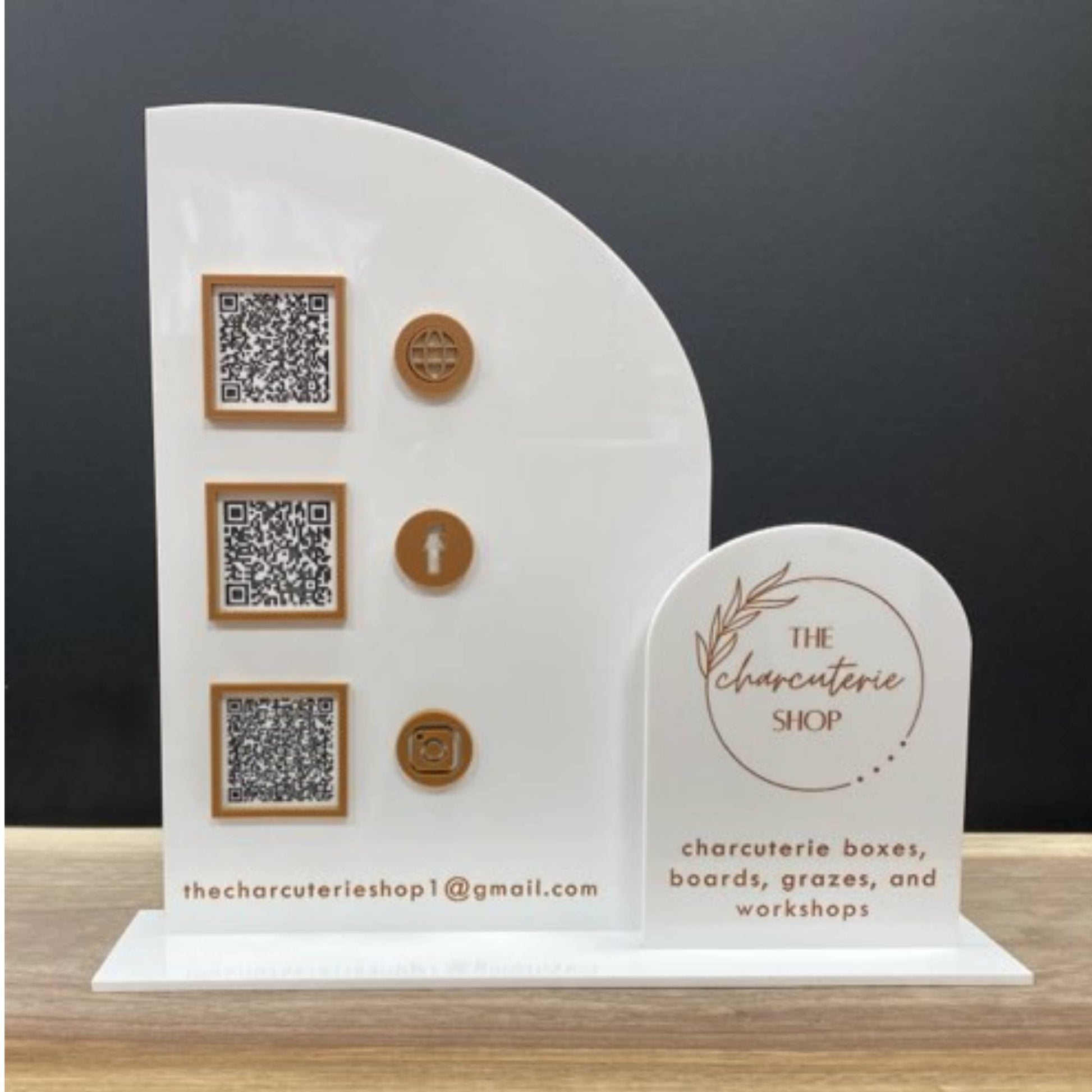 business sign with half arch and full arch layered with QR codes and logo