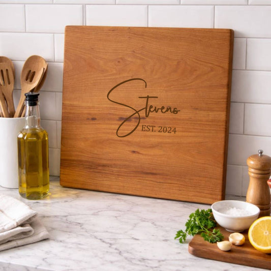 cherry cutting board custom engraved sitting on the kitchen countertop