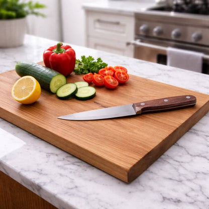 cherry cutting board sitting on kitchen island with veggies and knife