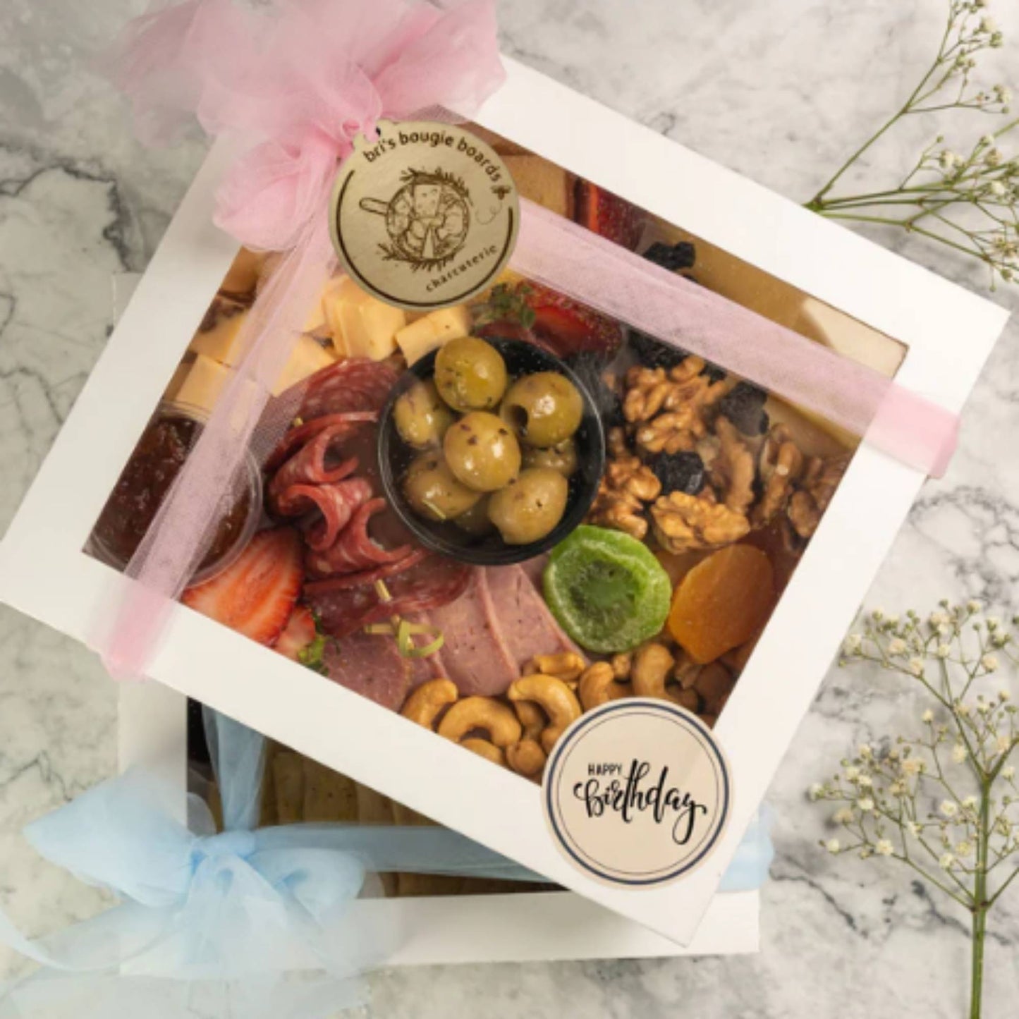 round wood charcuterie box tags with engraved logo