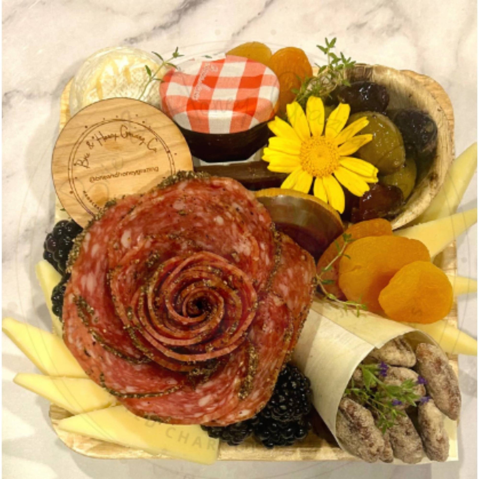 round wood custom engraved charcuterie box tag in charcuterie food