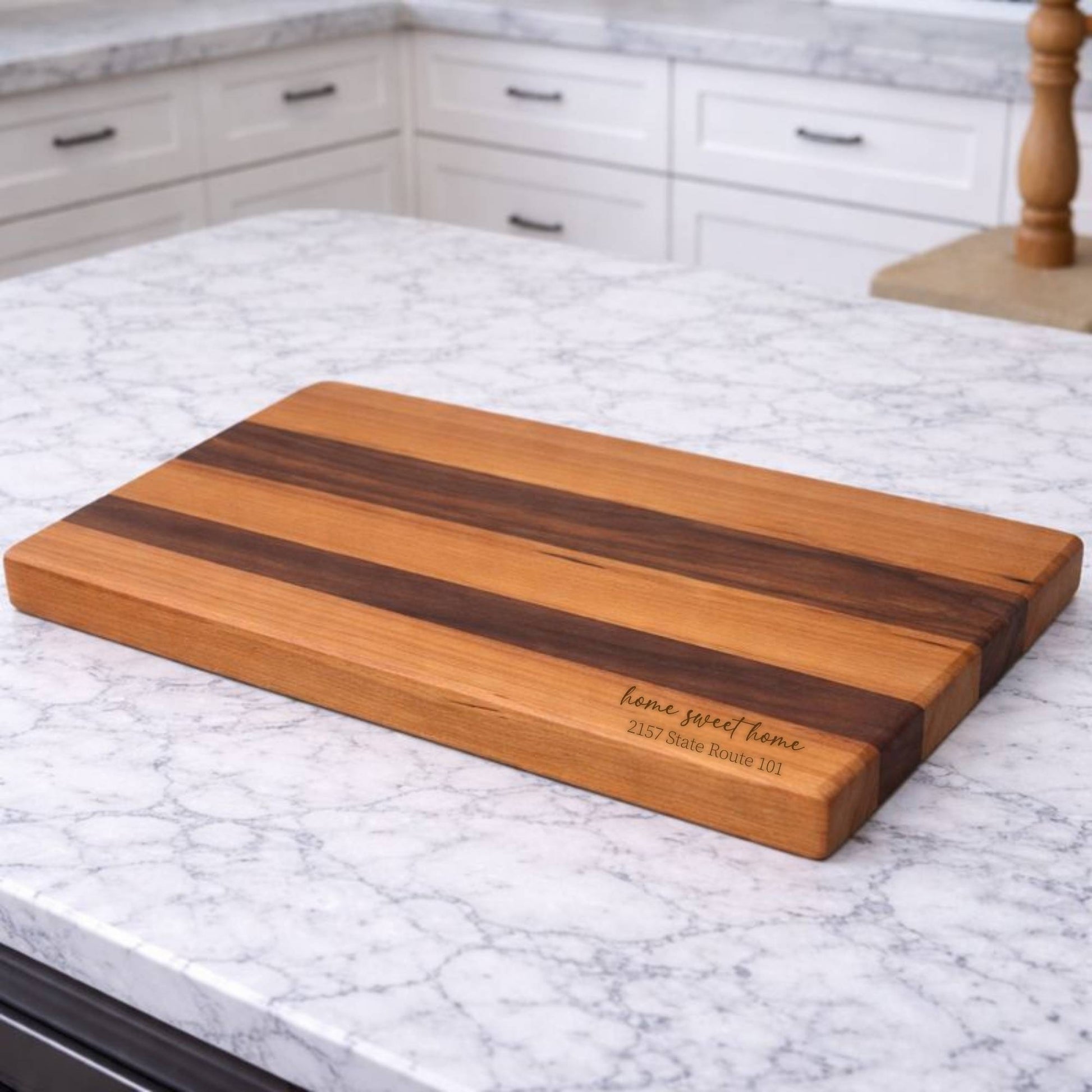 customized cherry and walnut cutting board on kitchen island
