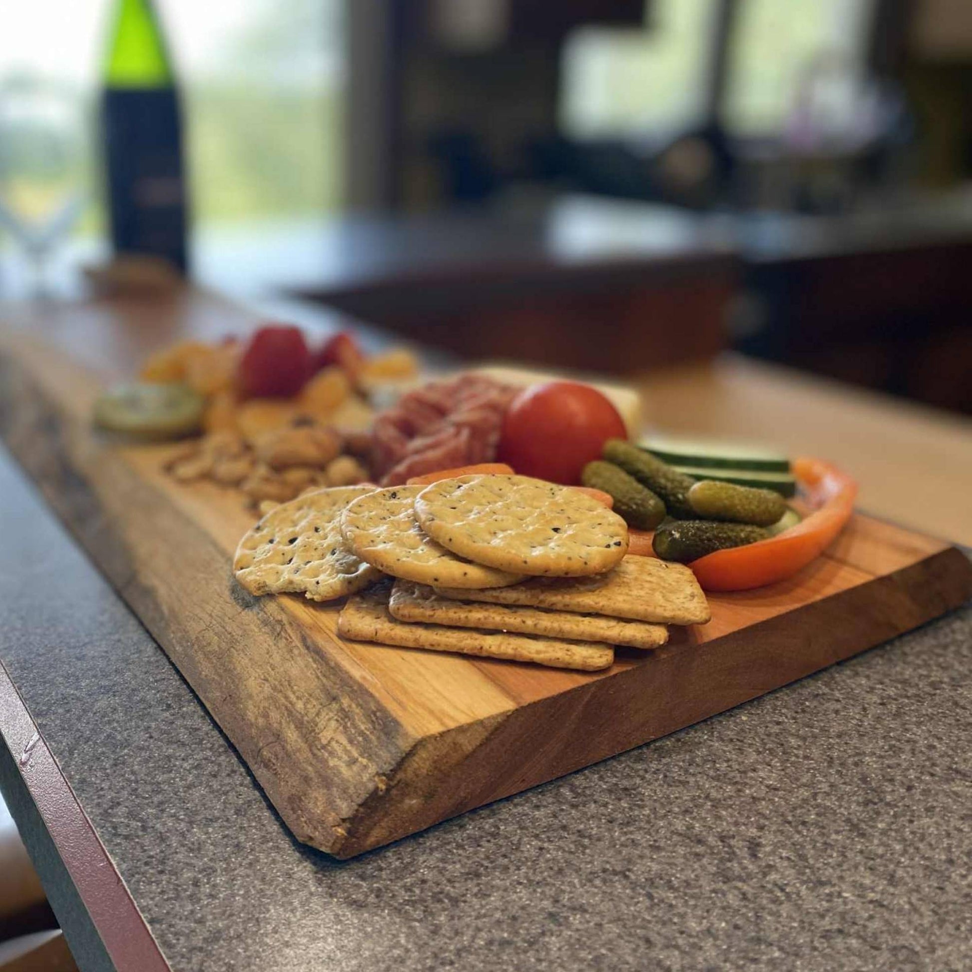 close up of live edge cherry board showing the natural edge of the board