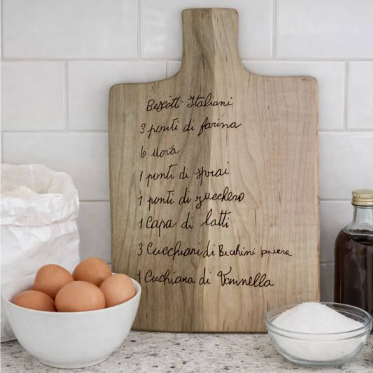 custom engraved recipe board sitting on kitchen counter
