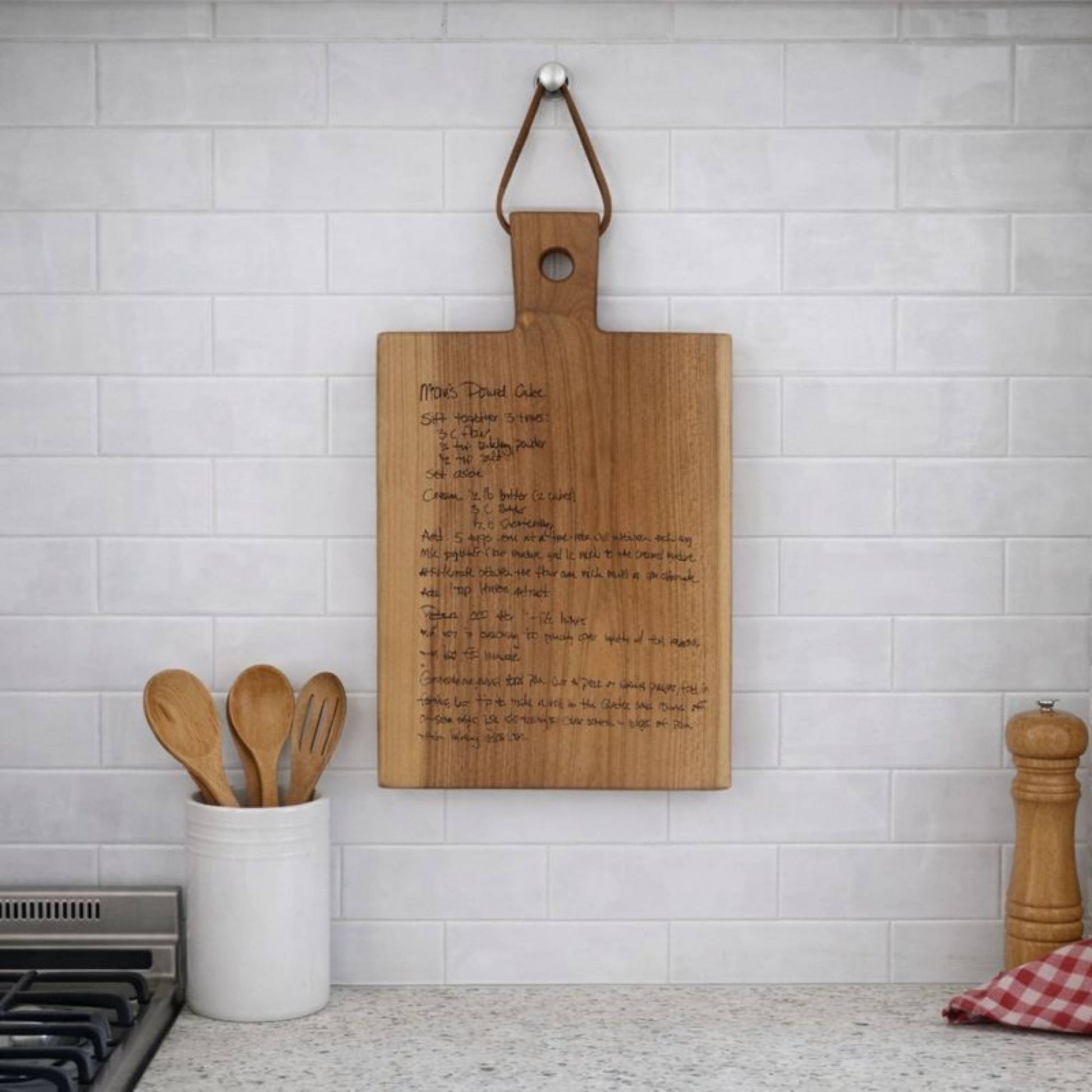 custom engraved recipe board displayed on the wall in the kitchen