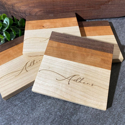 walnut, cherry, and maple handcrafted wood coasters with personalized engraving