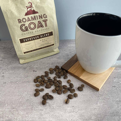 walnut, cherry, and maple handcrafted wood coaster with coffee mug and coffee beans