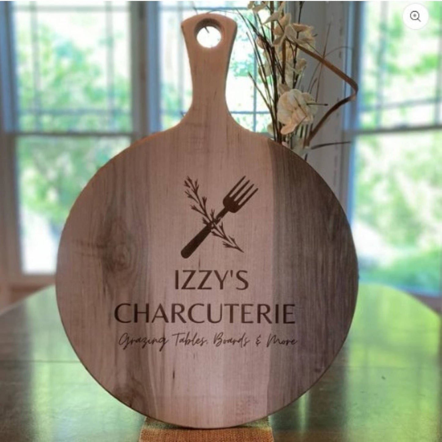 round wood serving board on dining room table 