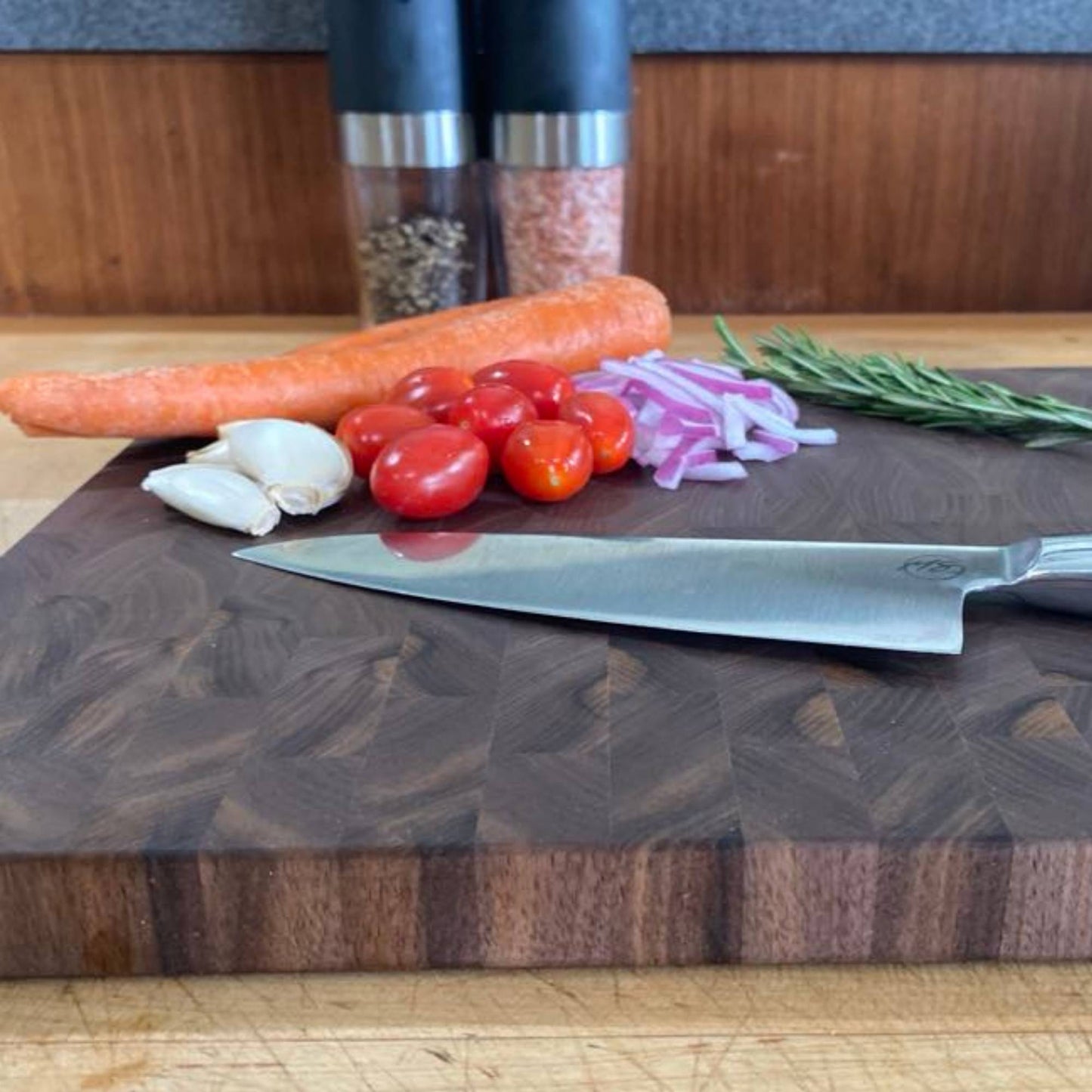 close up of walnut end grain cutting board showing the details in the grain and edge