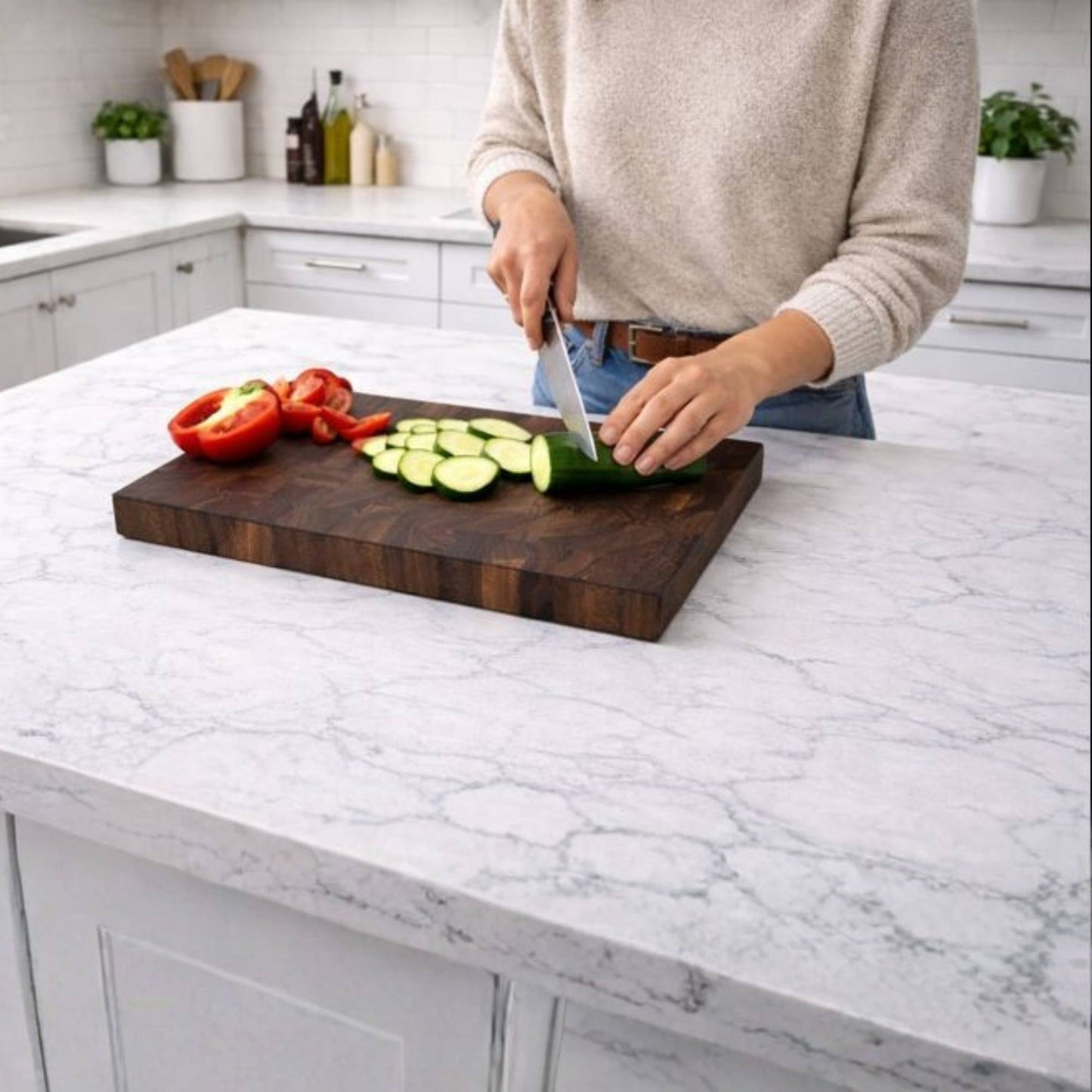 walnut end grain cutting board in kitchen with vegetables