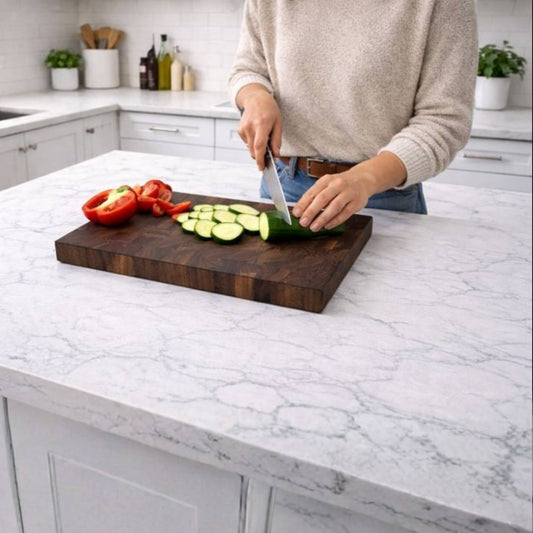 walnut end grain cutting board in kitchen with vegetables