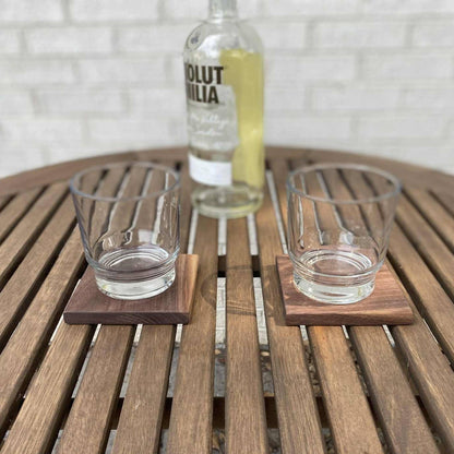 walnut wood coasters being used for glasses on table on back patio