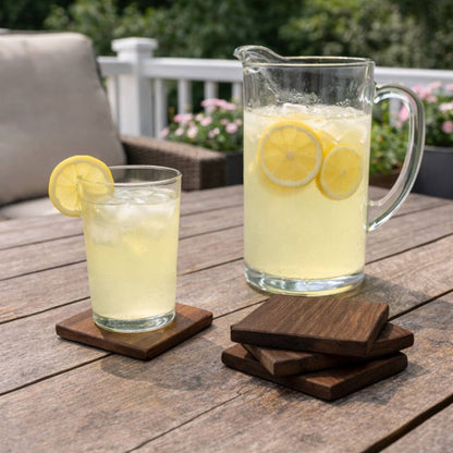 walnut wood coasters on table on the back deck with lemonade